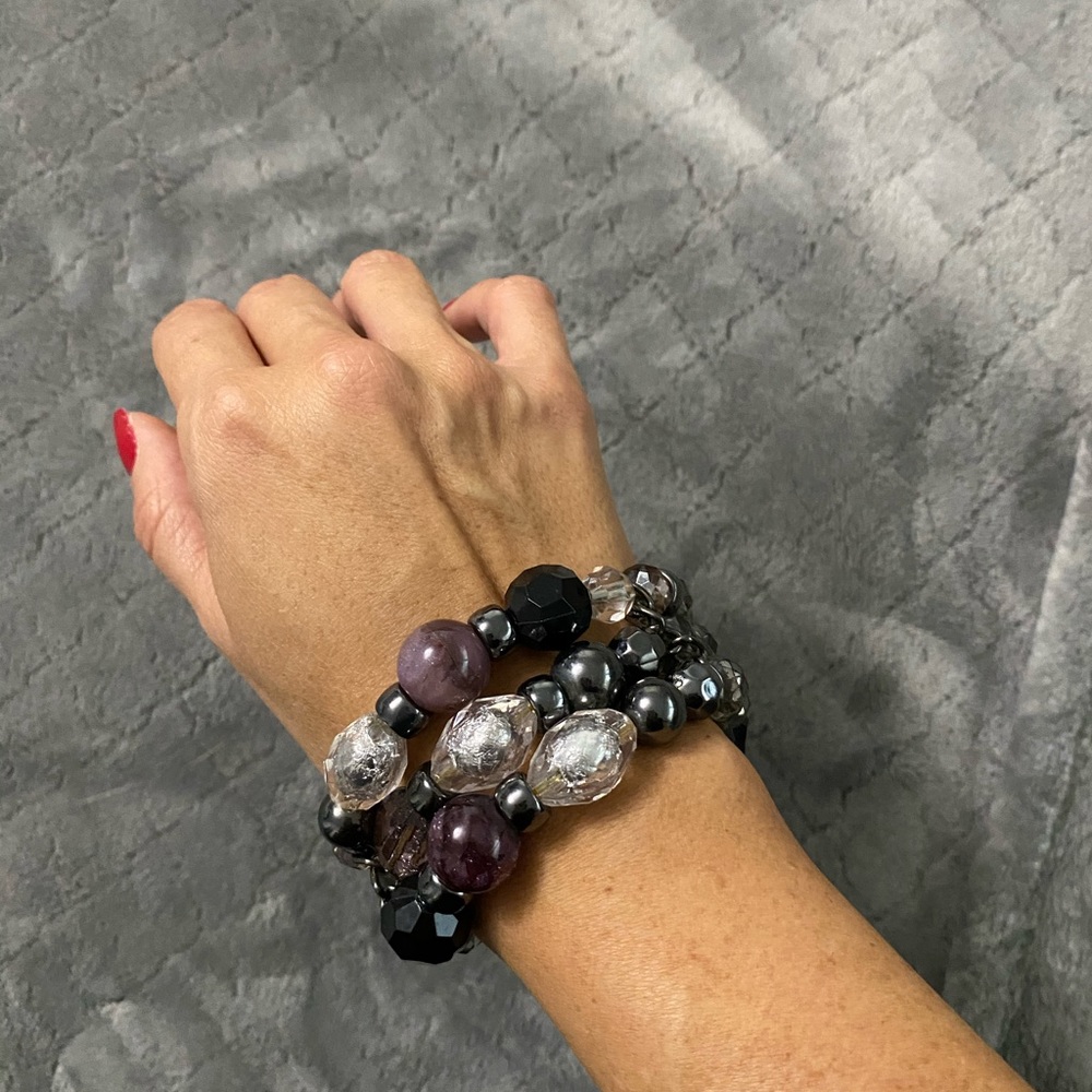 Stacked, beaded bracelets.